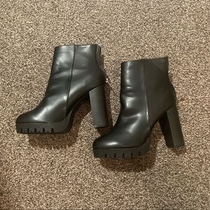 Black 3 inch heeled boots with silver zipper on back